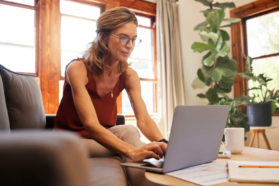 Woman working on a laptop at home